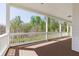 Spacious front porch with classic white railings, offering a serene spot to enjoy the surrounding natural beauty at 281 Chilhoe Dr, Canton, GA 30115