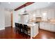Elegant kitchen with a central island and bar stool seating at 281 Chilhoe Dr, Canton, GA 30115