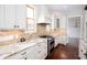 Beautiful kitchen with granite countertops and stainless steel appliances at 281 Chilhoe Dr, Canton, GA 30115