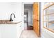 Bright laundry room with a sink and a view to the exterior at 281 Chilhoe Dr, Canton, GA 30115