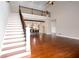 Open concept living room with hardwood floors and staircase leading to upper level at 281 Chilhoe Dr, Canton, GA 30115
