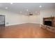 Spacious living room with a brick fireplace, ceiling fan, and recessed lighting at 281 Chilhoe Dr, Canton, GA 30115