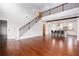 Sun-drenched, open-concept living area with a staircase and kitchen view at 281 Chilhoe Dr, Canton, GA 30115