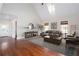 Living room with stylish furnishings, hardwood floors, and cathedral ceiling at 281 Chilhoe Dr, Canton, GA 30115