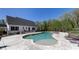 Stunning backyard with a luxurious pool, pergola, fire pit, and lounge chairs at 281 Chilhoe Dr, Canton, GA 30115