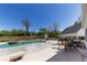 Private in-ground pool with integrated spa on a spacious patio featuring outdoor seating and well-maintained landscaping at 281 Chilhoe Dr, Canton, GA 30115