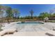 Expansive patio with a luxurious in-ground pool, spa, and outdoor seating, perfect for outdoor entertaining at 281 Chilhoe Dr, Canton, GA 30115