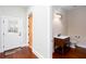 Hallway view of a powder room featuring a vanity with dark wood flooring at 281 Chilhoe Dr, Canton, GA 30115