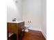 Modern powder room with a rustic vanity and dark wood flooring at 281 Chilhoe Dr, Canton, GA 30115