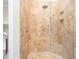 Walk-in shower with tiled walls, built-in seat, and upgraded shower head at 281 Chilhoe Dr, Canton, GA 30115