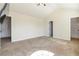 Spacious carpeted bedroom featuring neutral walls, white trim, and views into the attached bathroom at 3823 Dragon Fly Ln, Loganville, GA 30052