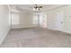Bright, carpeted bedroom with tray ceiling and windows for natural light at 3823 Dragon Fly Ln, Loganville, GA 30052