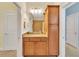 Bathroom featuring a vanity with granite countertop and wood cabinets at 498 Townsend St, Grayson, GA 30017