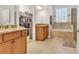 Luxurious bathroom featuring double sinks, a separate shower, and a walk in closet at 498 Townsend St, Grayson, GA 30017