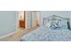Cozy bedroom features soft blue walls, plush carpet, and a comfortable bed with a floral patterned quilt at 498 Townsend St, Grayson, GA 30017