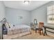 Comfortable bedroom with light blue walls, carpet and metal frame bed at 498 Townsend St, Grayson, GA 30017
