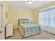 Comfortable bedroom with soft yellow walls, carpet and a cozy bed at 498 Townsend St, Grayson, GA 30017