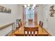 Charming dining room with a wooden table with seating for six and natural lighting at 498 Townsend St, Grayson, GA 30017