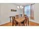 Cozy dining room featuring a wooden table with seating for four and natural lighting at 498 Townsend St, Grayson, GA 30017