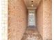 Close-up of the brick-lined entrance hallway leading to the front door at 498 Townsend St, Grayson, GA 30017
