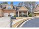 Charming brick home featuring a two-car garage and well-manicured landscaping at 498 Townsend St, Grayson, GA 30017