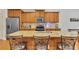 Spacious kitchen with stainless steel appliances, granite countertops, and a kitchen island with seating at 498 Townsend St, Grayson, GA 30017