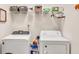 Functional laundry room with a washer, dryer, and ample storage space at 498 Townsend St, Grayson, GA 30017