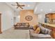 Comfortable living room with a fireplace, leather furniture, and a view to the kitchen at 498 Townsend St, Grayson, GA 30017