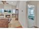 Bright living room featuring fireplace, TV, and views to adjacent bedroom at 498 Townsend St, Grayson, GA 30017
