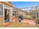Brick patio features an outdoor kitchen area with grill and pergola for entertaining at 498 Townsend St, Grayson, GA 30017