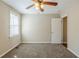 Bedroom with carpet, ceiling fan, and neutral paint at 1542 Columbia Dr, Decatur, GA 30032
