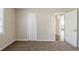 Bedroom with a neutral color scheme, plush carpet, and a closet at 1542 Columbia Dr, Decatur, GA 30032