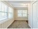Small room featuring two windows, carpet and white trim at 1542 Columbia Dr, Decatur, GA 30032