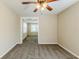 Neutral bedroom with carpet, ceiling fan, and adjoining room at 1542 Columbia Dr, Decatur, GA 30032
