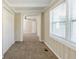 Hallway leading to a bedroom featuring carpet, closet and natural light at 1542 Columbia Dr, Decatur, GA 30032