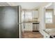 Modern kitchen with stainless steel appliances, granite counters, and white cabinetry at 1542 Columbia Dr, Decatur, GA 30032