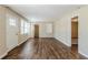 Bright living room with new wood flooring, fresh paint, and large windows at 1542 Columbia Dr, Decatur, GA 30032