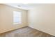 Bedroom featuring plush carpet and a window at 1908 Sailcloth St, Lithonia, GA 30058