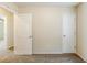 Bedroom featuring plush carpet and doors to hall and closet at 1908 Sailcloth St, Lithonia, GA 30058
