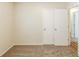 Bedroom with standard closet doors and plush carpet at 1908 Sailcloth St, Lithonia, GA 30058