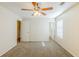 Bright bedroom featuring a ceiling fan and an attached bath at 1908 Sailcloth St, Lithonia, GA 30058