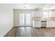 Bright kitchen featuring granite countertops, stainless steel appliances, and white cabinetry at 1908 Sailcloth St, Lithonia, GA 30058