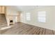 Inviting living room with stairs and front entry door and two large windows at 1908 Sailcloth St, Lithonia, GA 30058