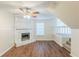 Cozy living room featuring a stone fireplace and modern wood-look flooring at 1908 Sailcloth St, Lithonia, GA 30058