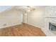 Spacious living room featuring wood floors, fireplace, and a ceiling fan at 1908 Sailcloth St, Lithonia, GA 30058