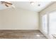 Bright living room with vaulted ceiling and french doors that open to the rear yard at 1908 Sailcloth St, Lithonia, GA 30058