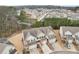 A neighborhood of townhomes showcasing community features and green surroundings from above at 2785 Maple Park Pl, Cumming, GA 30041