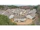 An aerial view of townhomes showcasing the architecture and surrounding community at 2785 Maple Park Pl, Cumming, GA 30041