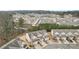 Aerial view of a townhome community surrounded by lush green trees at 2785 Maple Park Pl, Cumming, GA 30041