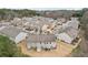 Neighborhood aerial showcasing townhomes with backyard patios and ample parking at 2785 Maple Park Pl, Cumming, GA 30041